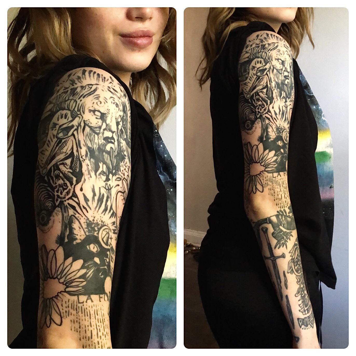 Nature's wild spirit flows down this stunning full sleeve, where a majestic lion's mane blends seamlessly into intricate florals and mystical elements. The masterful black and grey shading creates incredible depth, transforming the entire arm into a living canvas that tells a story of strength and natural beauty 🦁 The artist's attention to detail in the botanical elements perfectly balances the powerful feline imagery above.