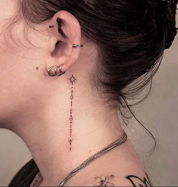 Delicate celestial magic cascades down the neck in this enchanting fine-line tattoo, featuring a four-pointed star that trails into an intricate vertical design of dots, diamonds, and mystical symbols. The precision of the linework creates an almost ethereal quality that perfectly complements the wearer's curated ear piercings ✨ This piece transforms the neck into a canvas for celestial storytelling, where minimalist artistry meets cosmic symbolism.