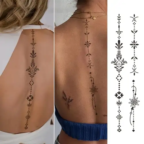 Delicate geometric patterns cascade down the spine like ancient symbols telling a story, featuring intricate crosses, botanical motifs, and tribal-inspired elements that create a mesmerizing vertical journey ✨ The precision of these temporary tattoos demonstrates how spine art can be both bold and ethereal, perfectly complementing the natural curve of the back.