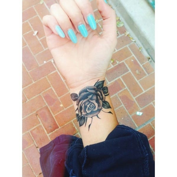 Delicate petals and thorny stems cascade beautifully around this wrist, creating a stunning floral bracelet that moves with every gesture. The black and gray shading brings incredible depth to each rose bloom, while the strategic placement makes it feel like nature's own jewelry 🌹 Perfect for anyone who wants their ink to feel both feminine and fierce!