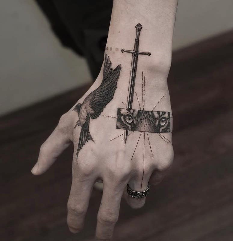 Geometric precision meets organic beauty in this striking hand tattoo that transforms skin into a canvas of symbolic storytelling. The juxtaposition of a soaring bird against piercing feline eyes creates an almost mystical narrative, while the central sword adds an element of strength and protection to this deeply personal piece of body art. ⚔️✨