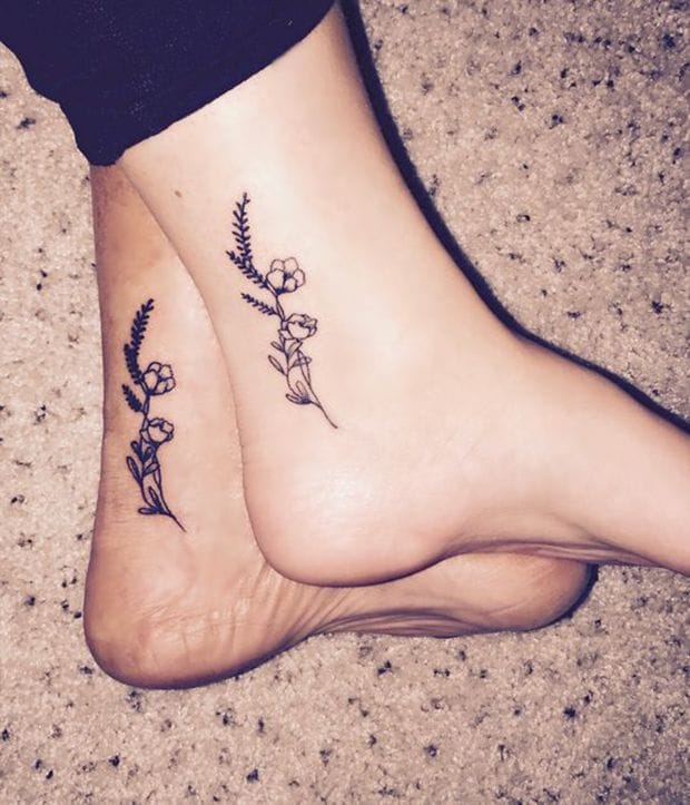 Delicate botanical sprigs dance across both ankles in perfect symmetry, creating an enchanting matching set that celebrates nature's simple beauty. The fine line work captures every tiny leaf and bloom with remarkable precision, while the mirrored placement transforms each step into a graceful display of floral artistry 🌿