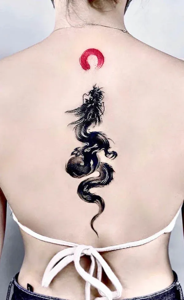 Mesmerizing brushwork brings this ethereal dragon to life as it spirals down the spine, crowned by a bold crimson moon that commands attention 🐉 The flowing, ink-wash style creates an almost living quality - as if the mythical creature might unfurl its serpentine form and take flight at any moment.