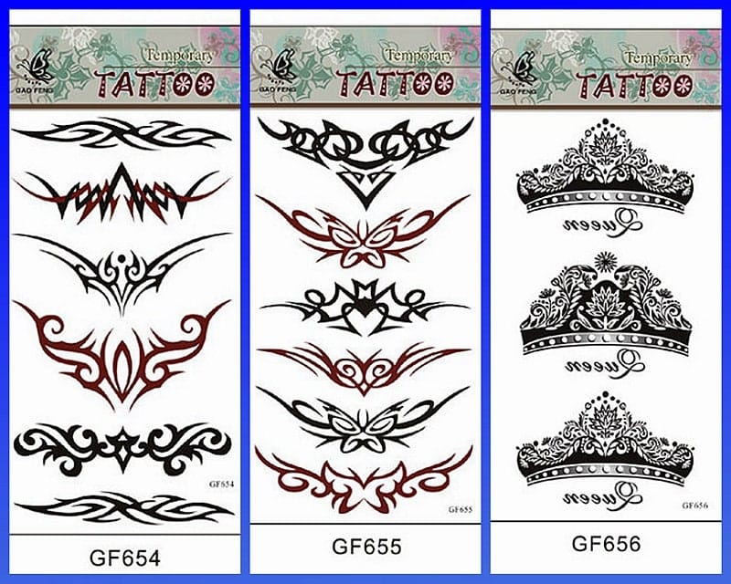 **Tribal Elegance Meets Modern Flair** 🖤
Three stunning temporary tattoo sheets showcase the timeless appeal of tribal artistry with a contemporary twist. The first sheet (GF654) features bold geometric patterns and flowing tribal bands perfect for arms or shoulders, while the second (GF655) offers intricate symmetrical designs with striking red accents that create beautiful lower back or chest pieces. Sheet GF656 brings regal sophistication with ornate crown motifs that transform any placement into a statement of power and grace.