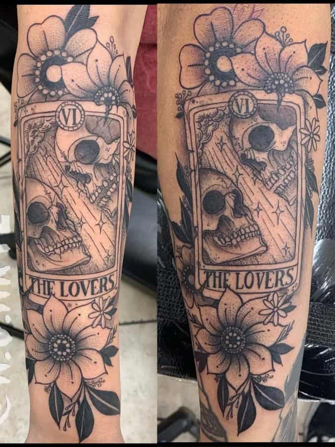 Dark romance meets tarot mystique in this hauntingly beautiful forearm piece featuring 
