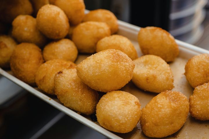 a bunch of doughnuts that are on a tray