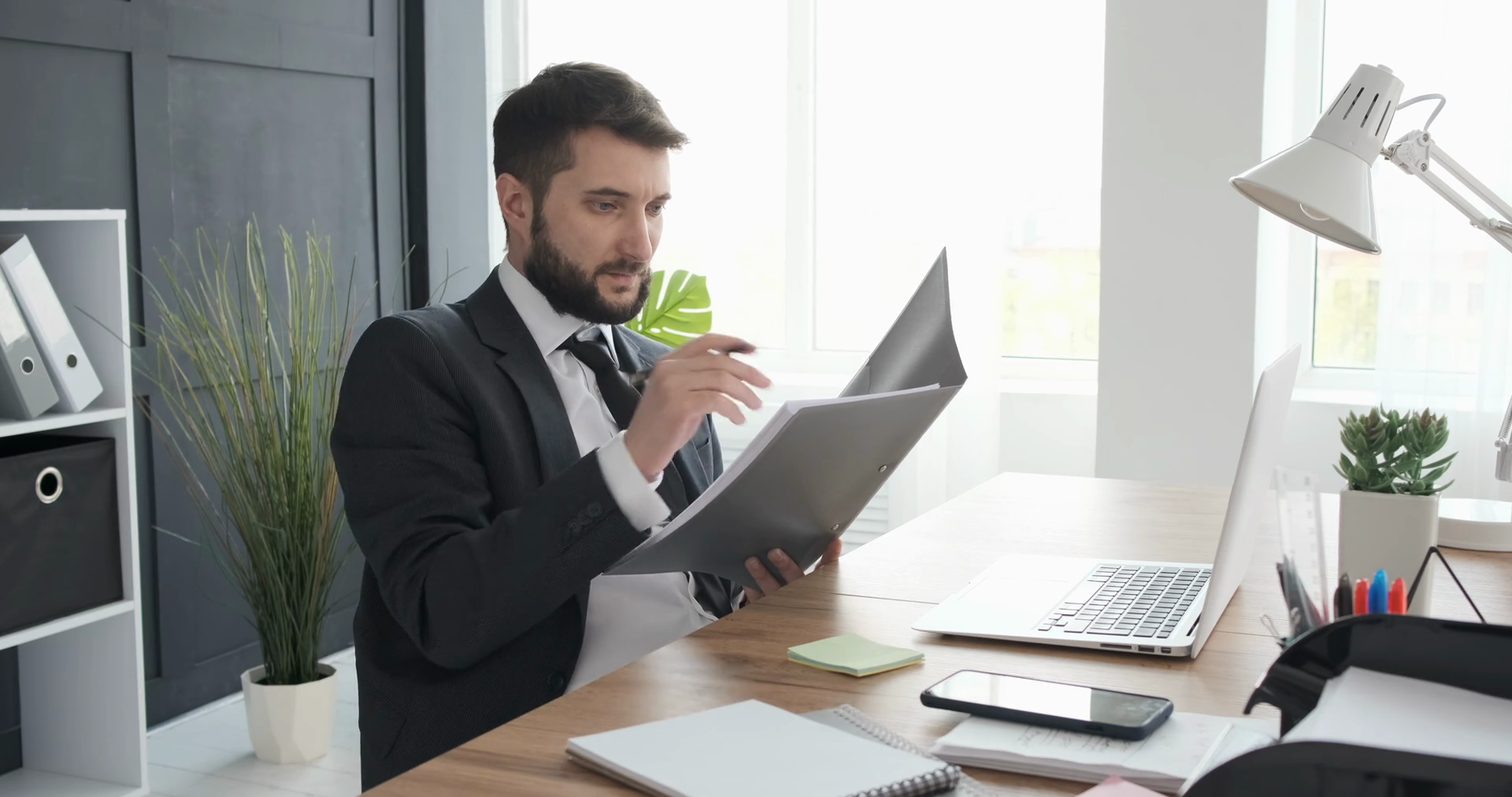 person reading document - How To Dissolve An LLC In Texas