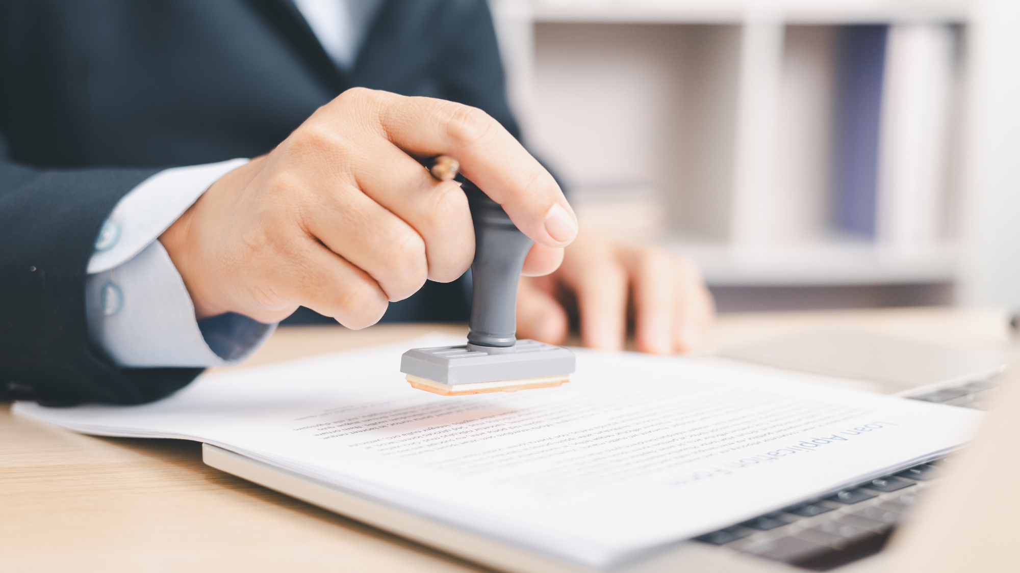 man adding stamp - How To Dissolve An LLC In Texas