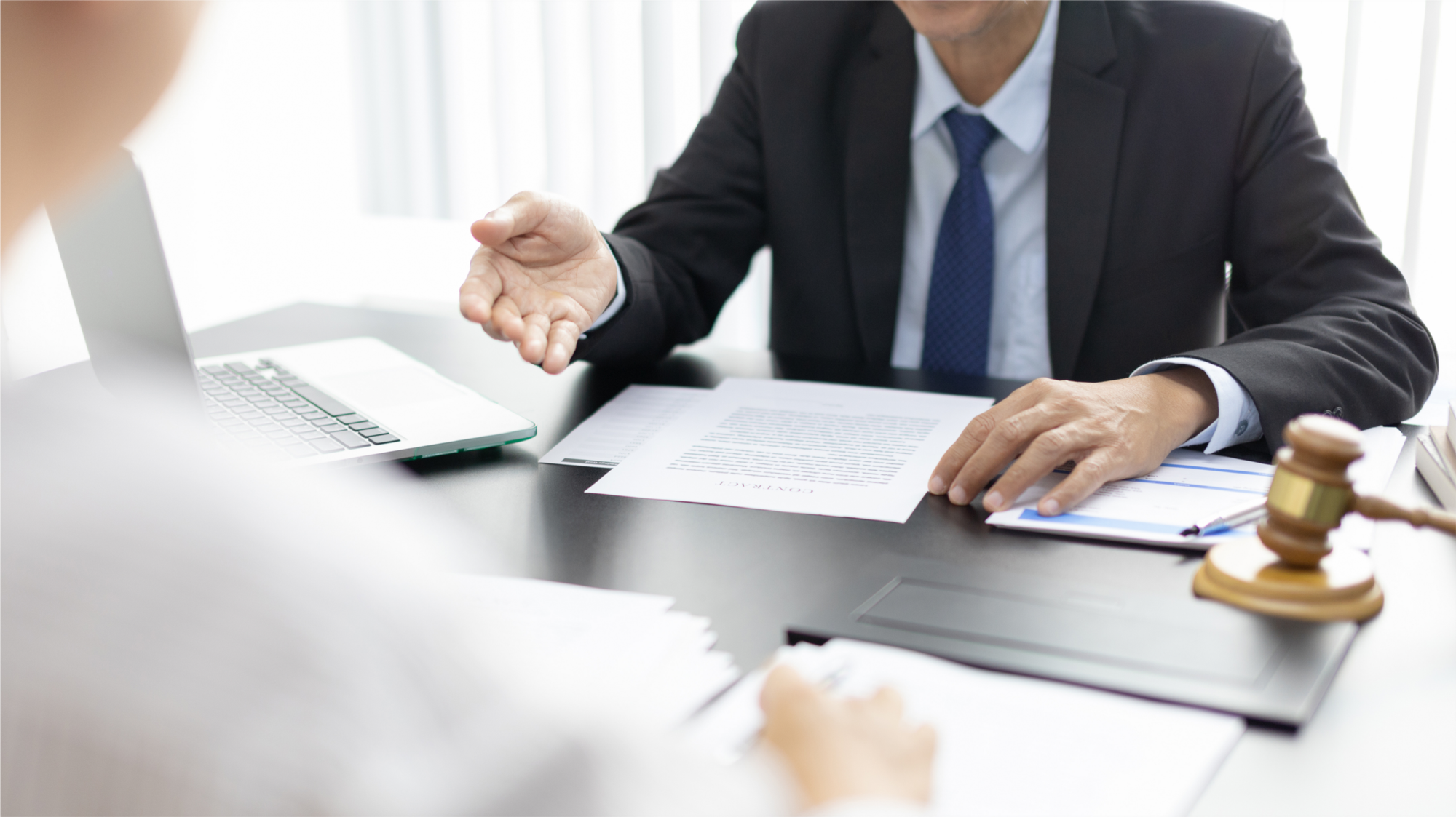 person in a meeting - How To Dissolve An LLC In Texas