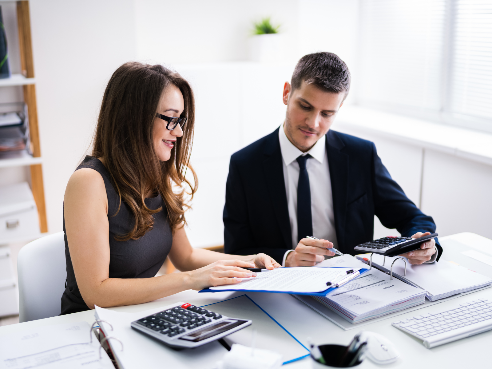 man with his assistant - How To Dissolve An LLC In Texas