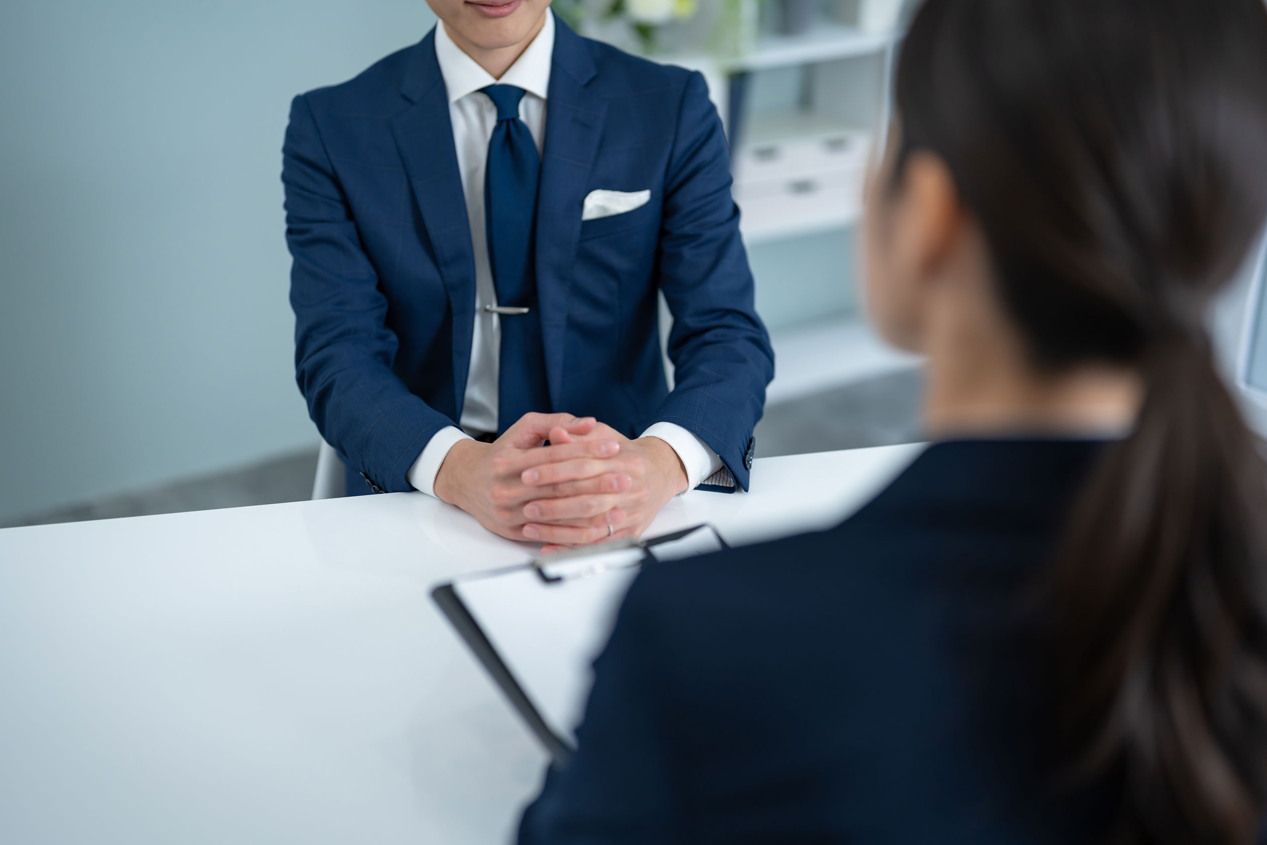 man sitting in a meeting - How to Dissolve an LLC in Missouri