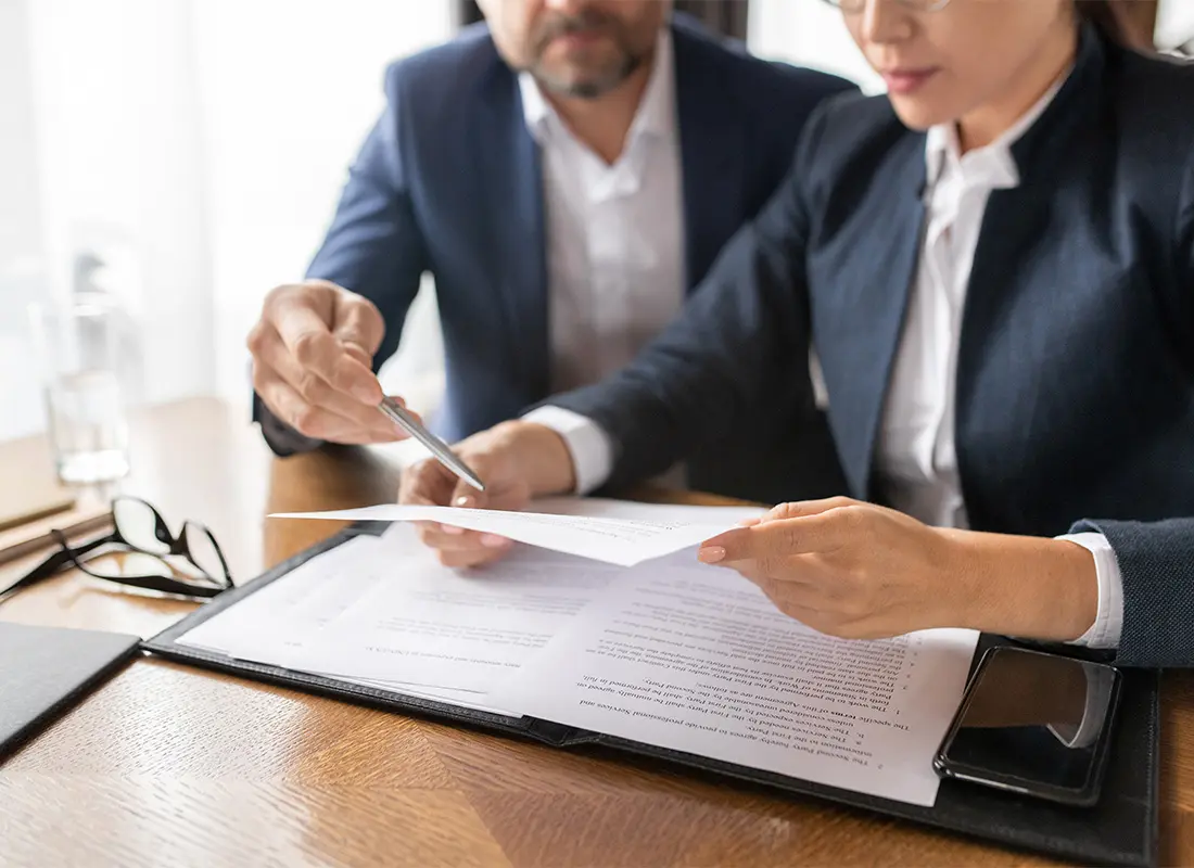 person looking at the documents - How to Dissolve an LLC in Kentucky