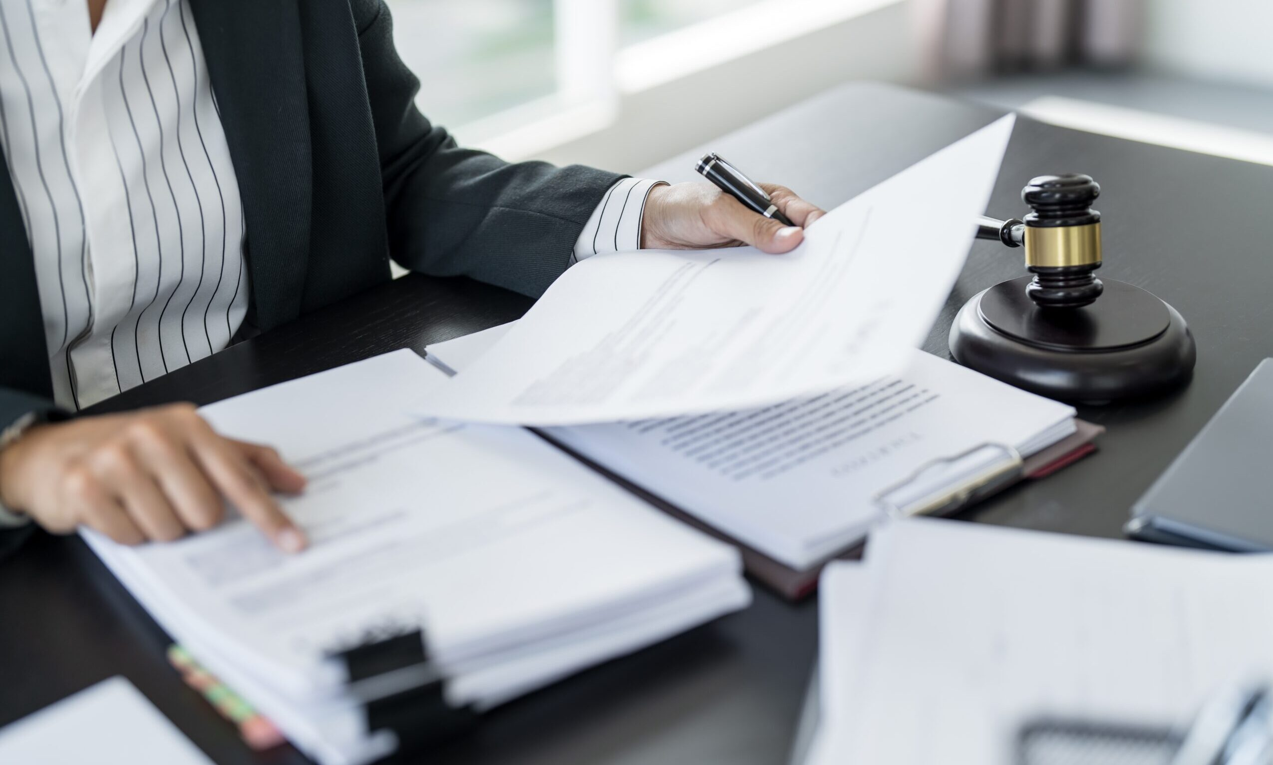 person sorting documents - How to Dissolve an LLC in Tennessee