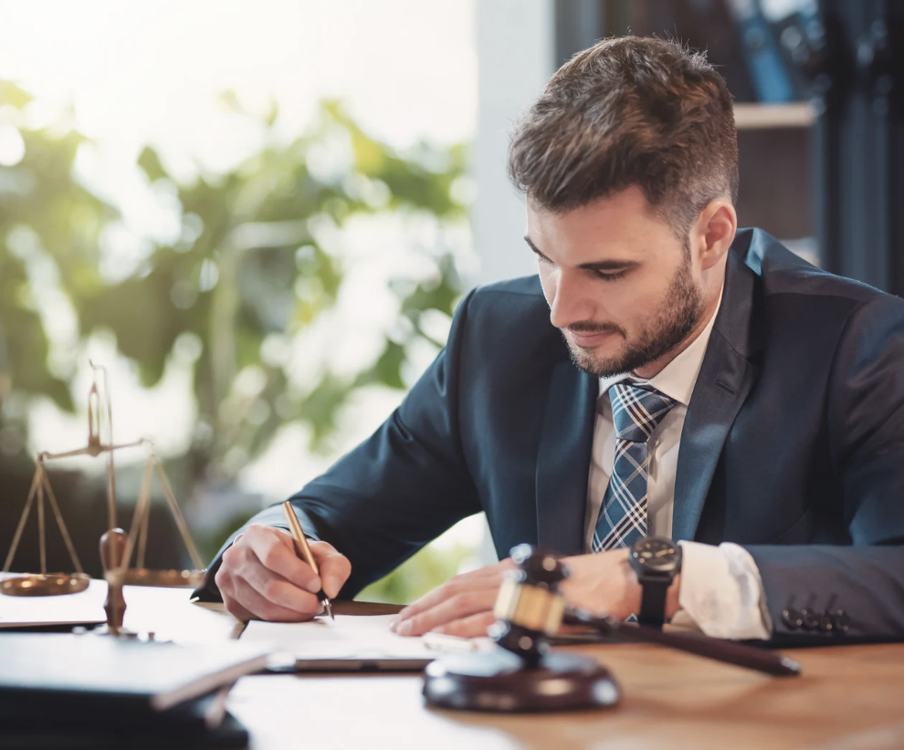 man signing - How to Dissolve an LLC in Colorado