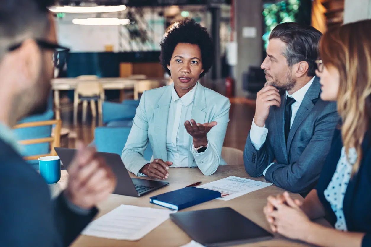 woman heading a meeting - How To Dissolve An LLC In Vermont