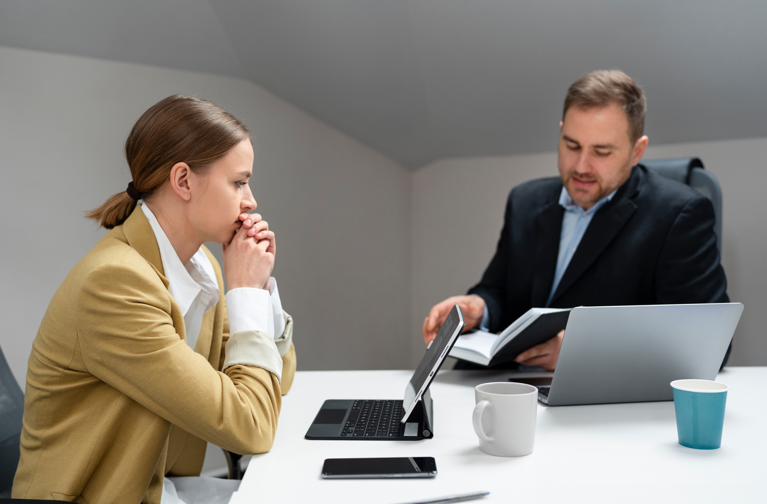 person looking at laptop - How to Dissolve an LLC in Missouri