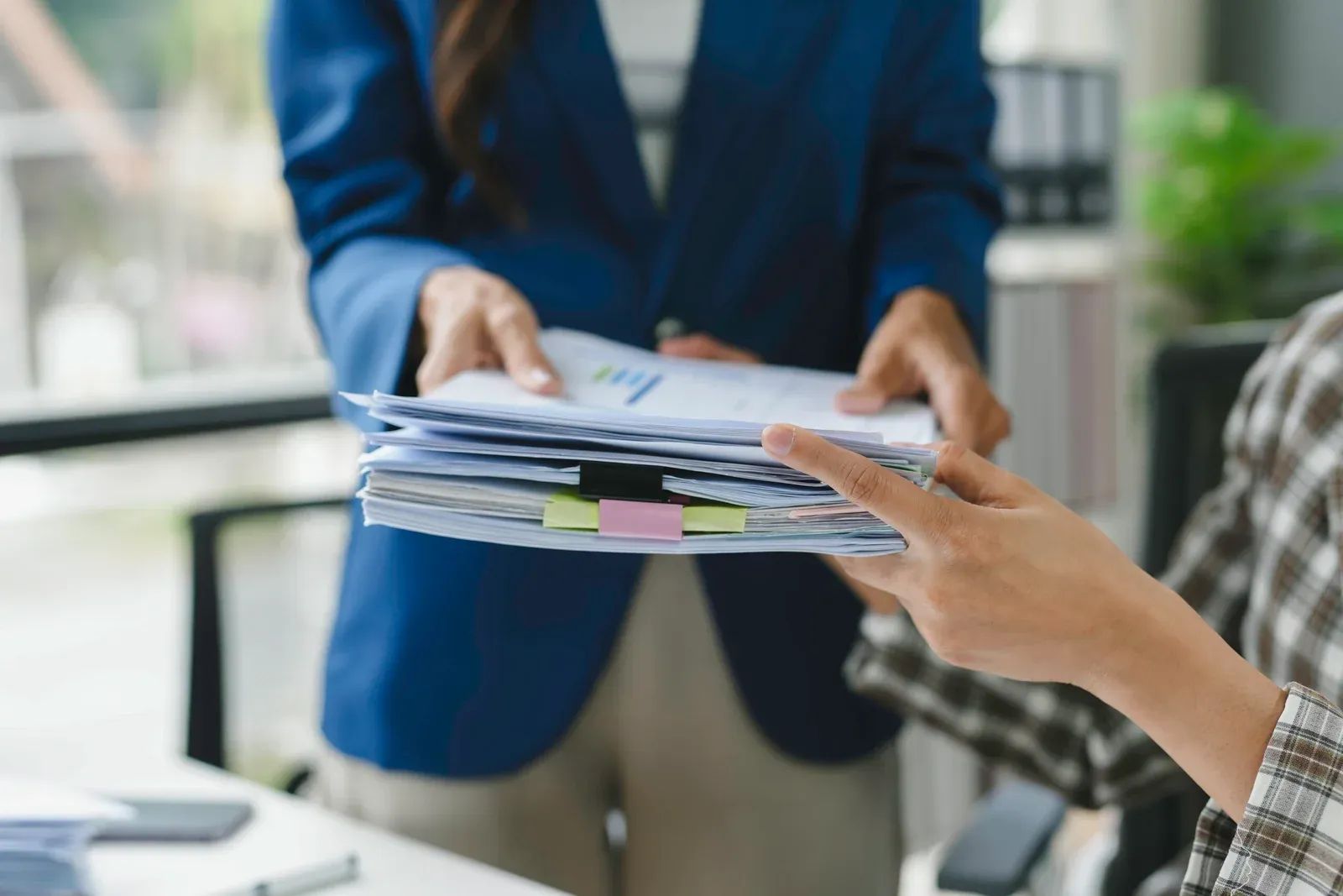 Person handling multiple documents - How to Dissolve an LLC in Arizona 