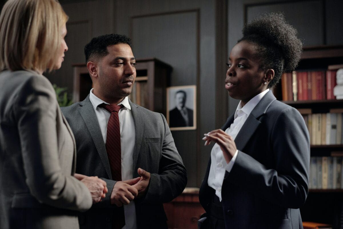 man talking to his lawyer - How to Dissolve a Corporation in Delaware 