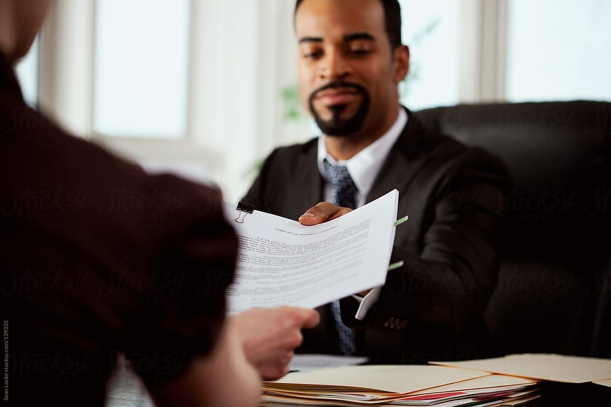 man helping lawyer - How to Dissolve a Corporation in Alabama