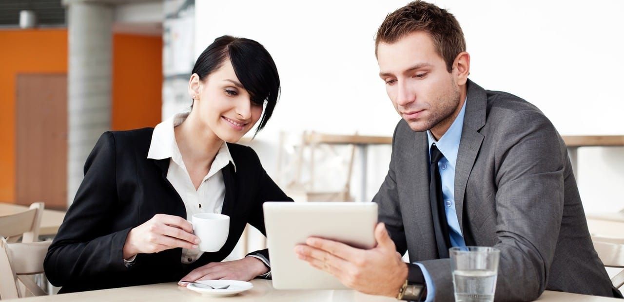 man reviewing document - How to Dissolve a Corporation in New York