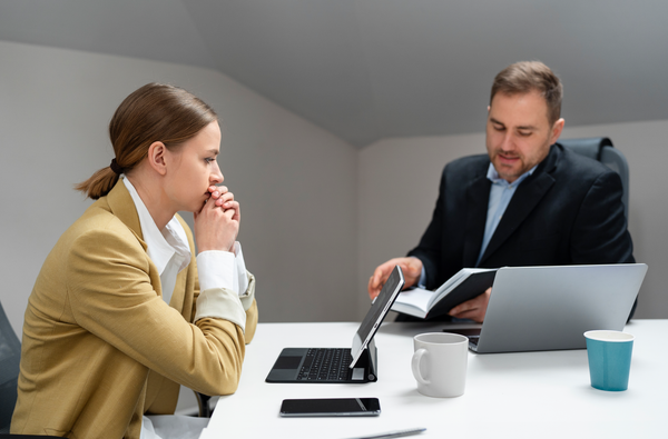 person looking at laptop - How to Dissolve an LLC in Missouri