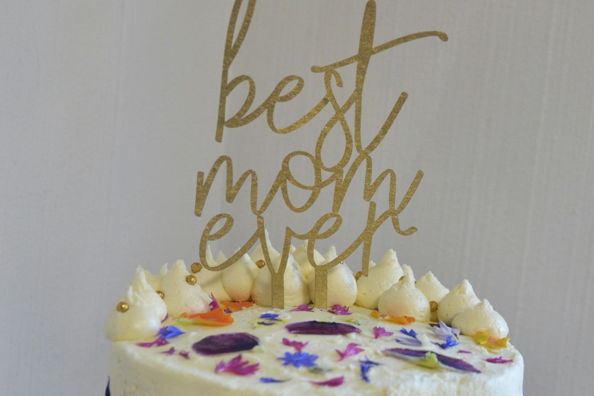 white and yellow cake with happy birthday text