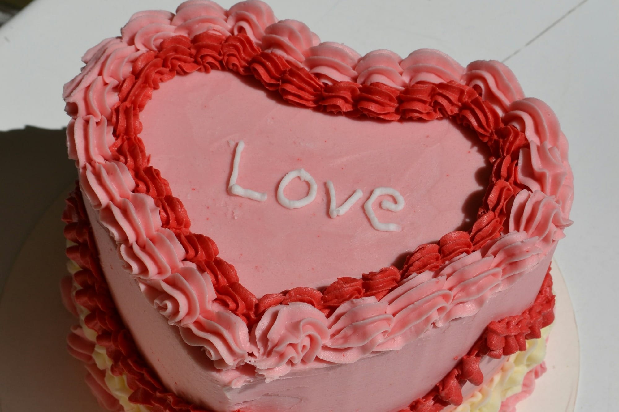 a cake with a red frosting