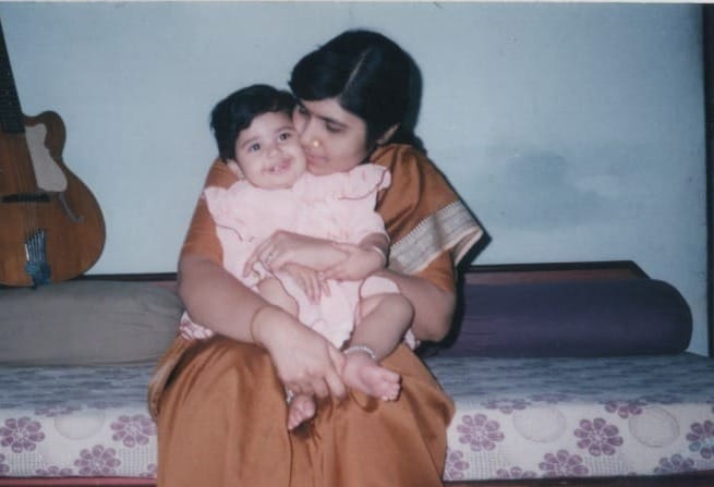 On mother's laps, Indore, India (2000)