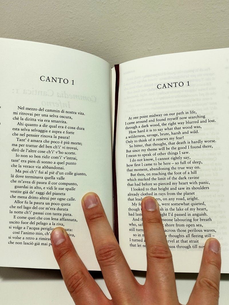 Picture of Antonello Mirone (Art Historian), holding a copy of the Divine Comedy, Canto I of the Inferno.