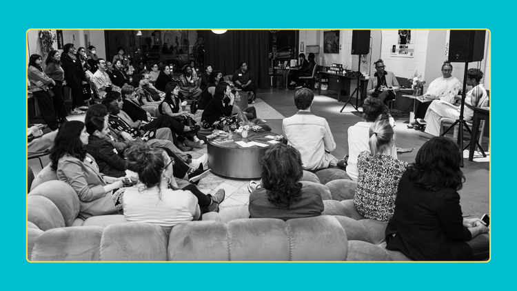 Photo Credit: Bethanie Hines - Black and white photo of Next River's event, with three speakers on the r and the crowd seated watching.