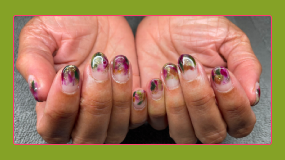 Close up image of Mia Birdsong's creatively painted nails.
