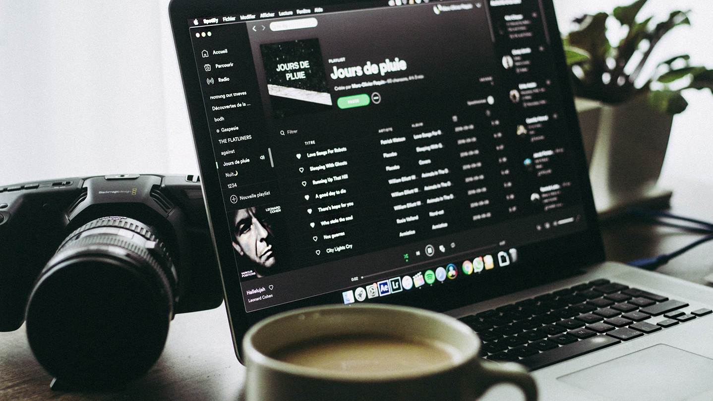 Laptop displaying a Spotify playlist