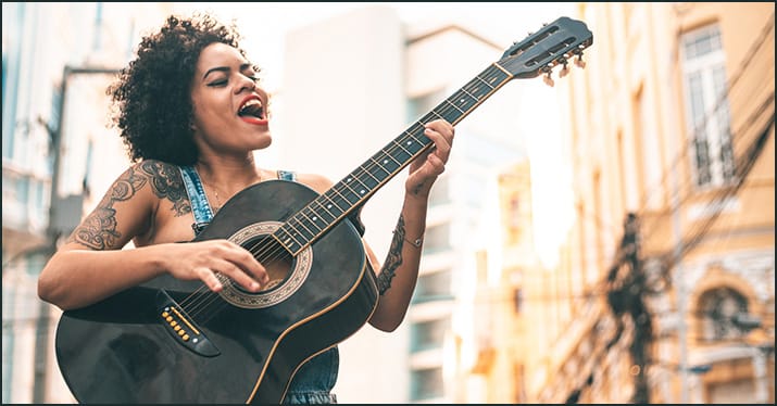 woman busking on the streets of the city