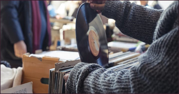record store browser checking out an EP vs album