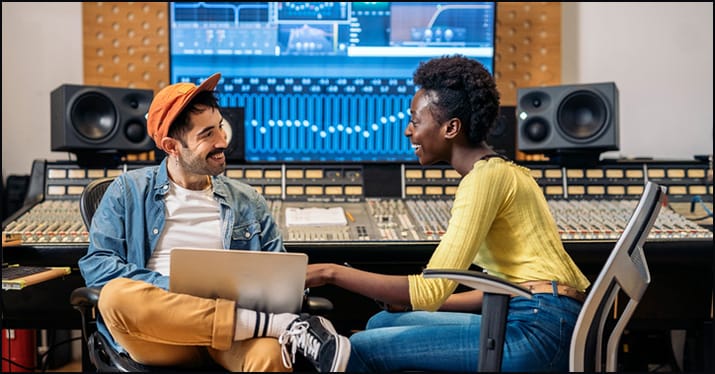 artist and producer in the studio making an album
