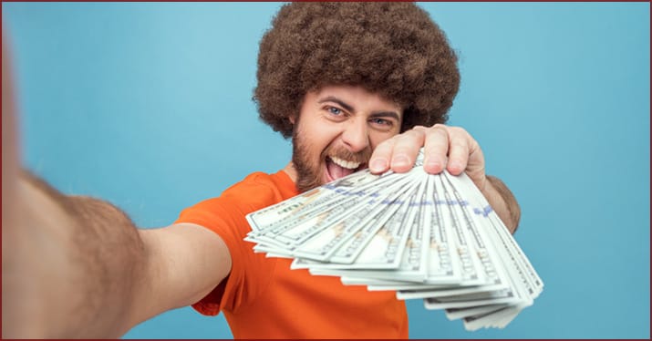 Artist showing off TikTok royalties payout of cash