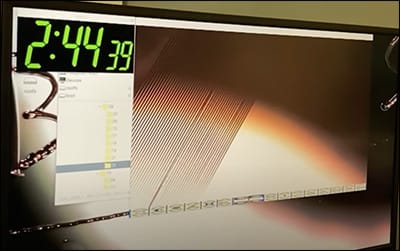 screenshot of a microscopic view of vinyl record grooves