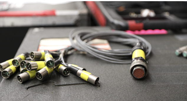 A picture of a  silver 14-channel fan out plugs with yellow ends is portrayed 