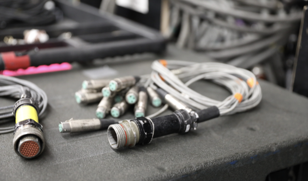 A picture of a silver 14-channel fan out sockets is depicted