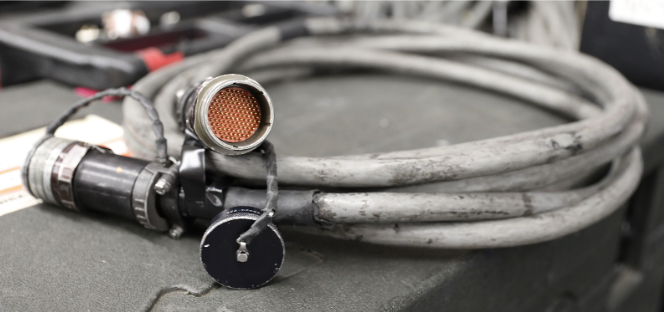 A picture of a silver 40-channel snake with multi-pin connectors is depicted