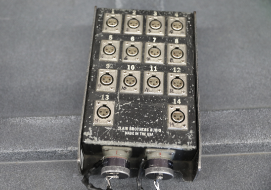A picture of a 14-channel sub snake box with silver inputs is portrayed