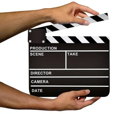 Clapperboard on white background, film production equipment, filmmaking tools, movie set accessory, cinematography, professio