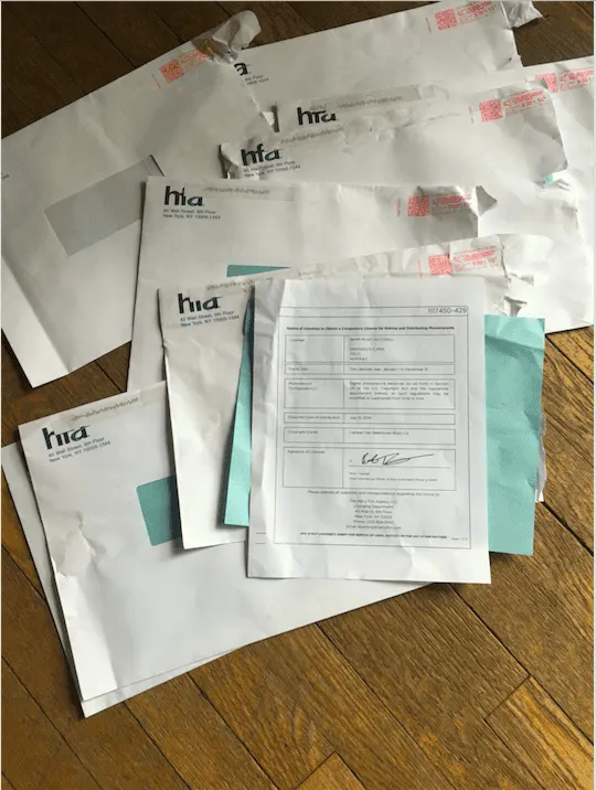 Envelopes and documents from the Health Insurance Coverage and Benefits Administration (HIA) on a wooden surface.