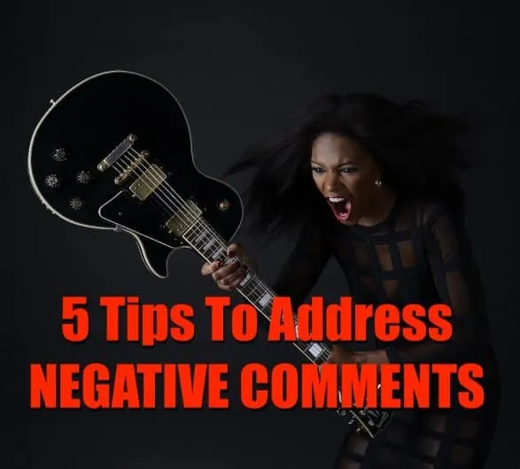 Assertive woman yelling with electric guitar, addressing negative comments, social media, music industry, online reputation m