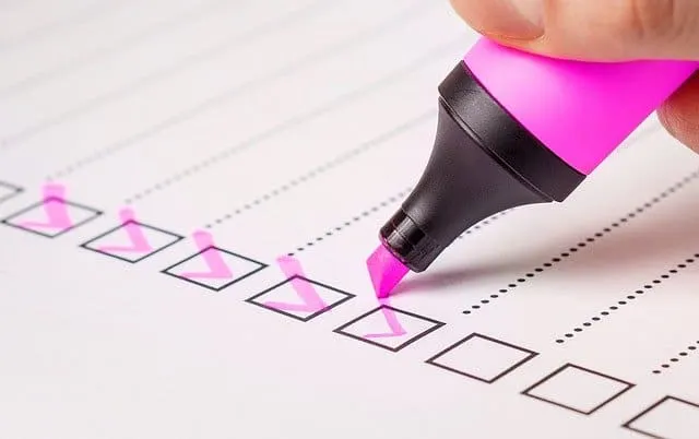 Pink highlighter marking checkboxes on a survey or checklist, symbolizing task completion and productivity.