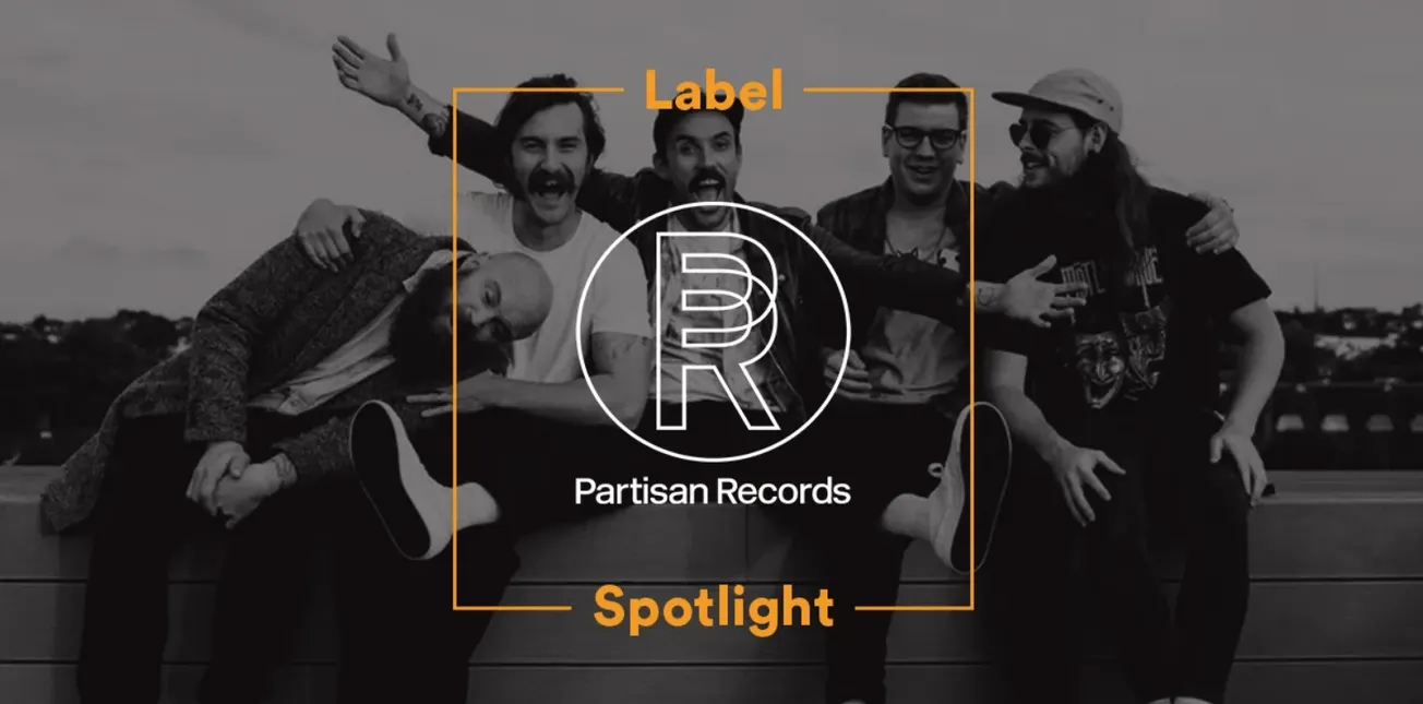 Friends group photo on a rooftop with Partisan Records logo, music branding, and modern entertainment vibe.