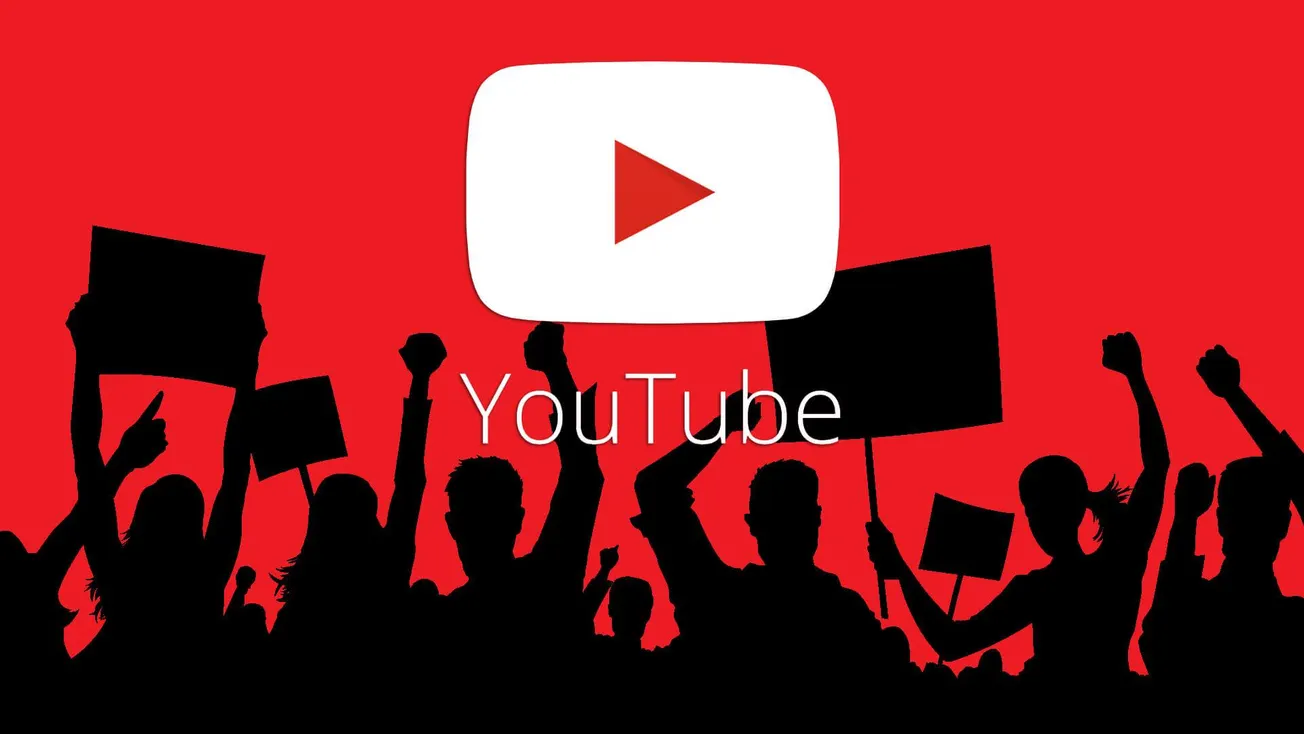 Protesters holding signs and raising fists at a digital activism event related to YouTube, with the YouTube logo and vibrant