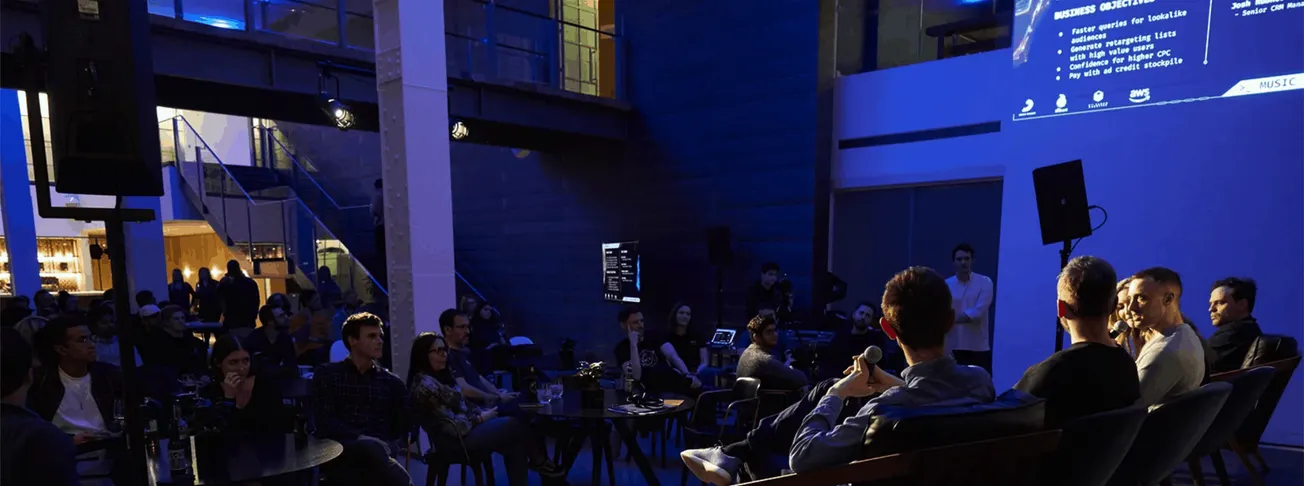 Basketball-themed event with presentation, audience, and stage setup in a modern indoor venue, emphasizing technology and ent