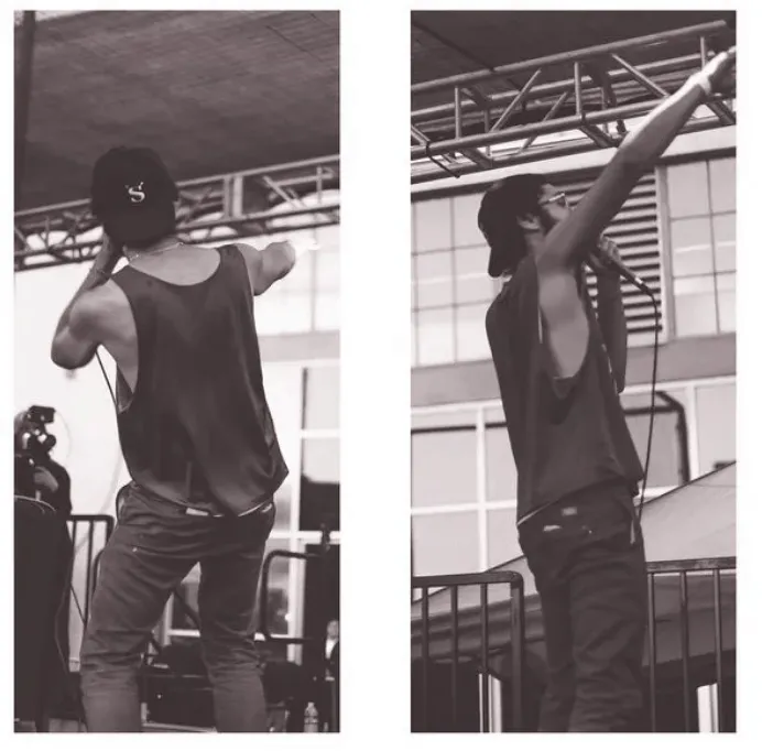 DJ performing live at a music event, showcasing turntables and music equipment for DJ performance, with a focus on music indu