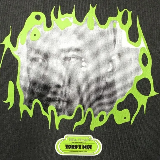 A vintage black-and-white portrait of a man surrounded by neon green graffiti-style design.